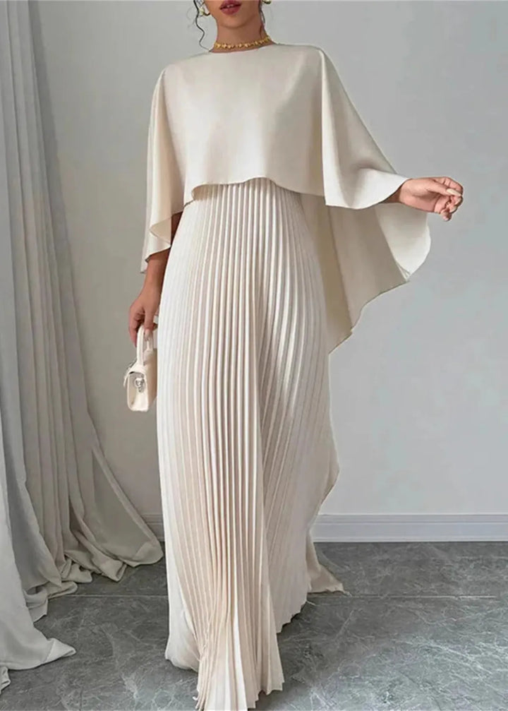 Women's elegant black tie maxi dress with cape overlay & pleated skirt, perfect for formal events & wedding guests.
