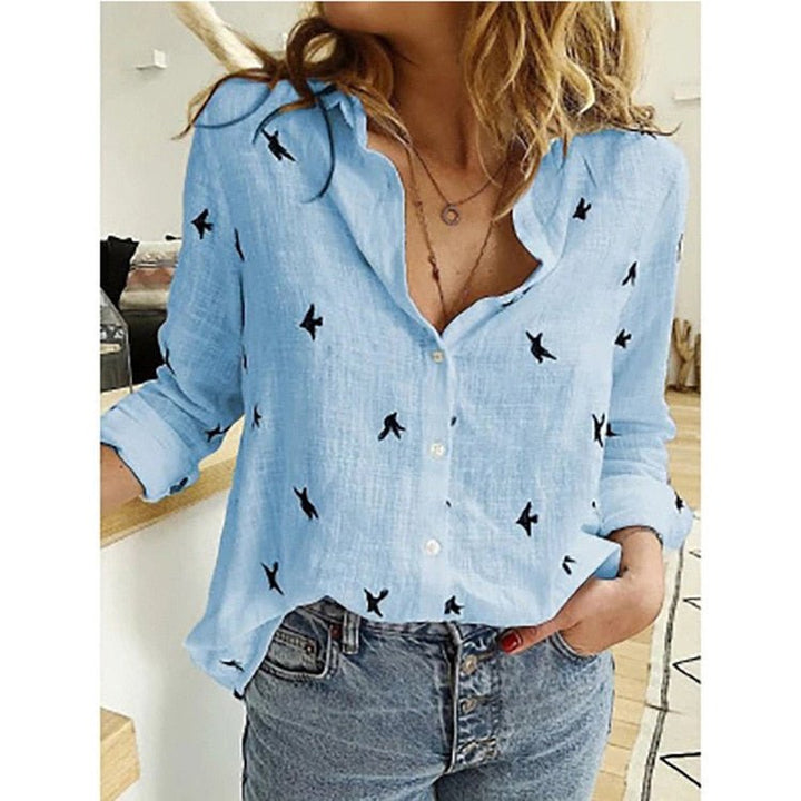 Solid color women's stylish blouse, comfortable relaxed fit. Long-sleeve top for office & casual wear.