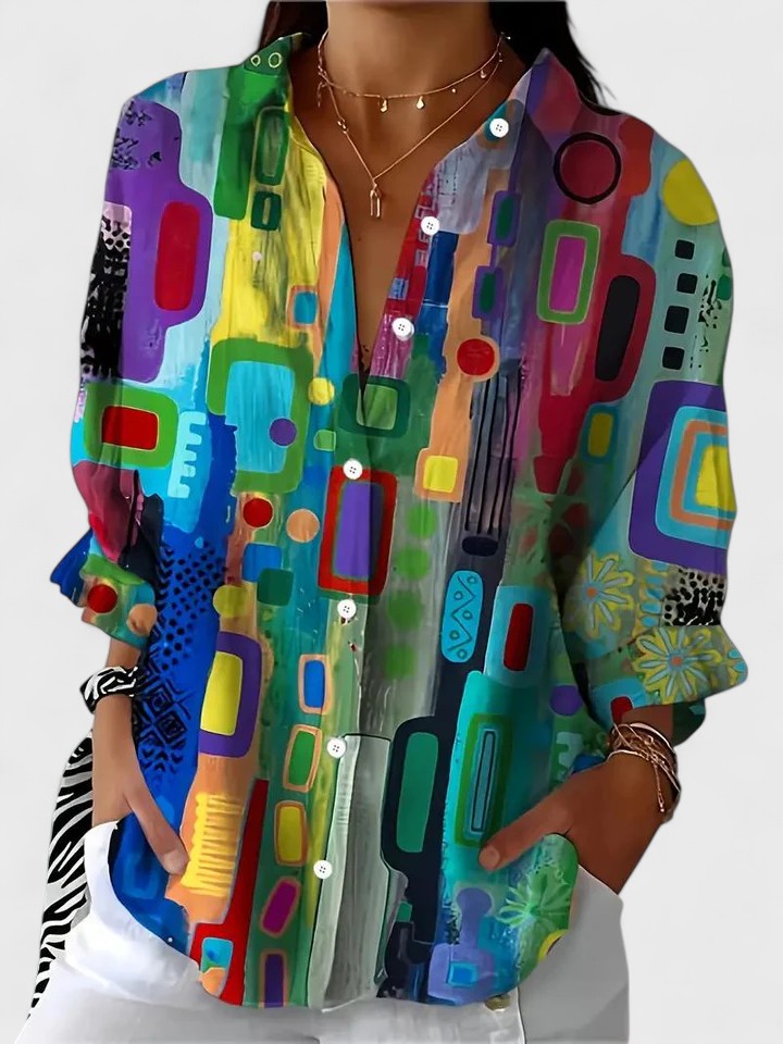Women's elegant blouse with a modern geometric pattern, perfect for stylish office wear or casual chic.