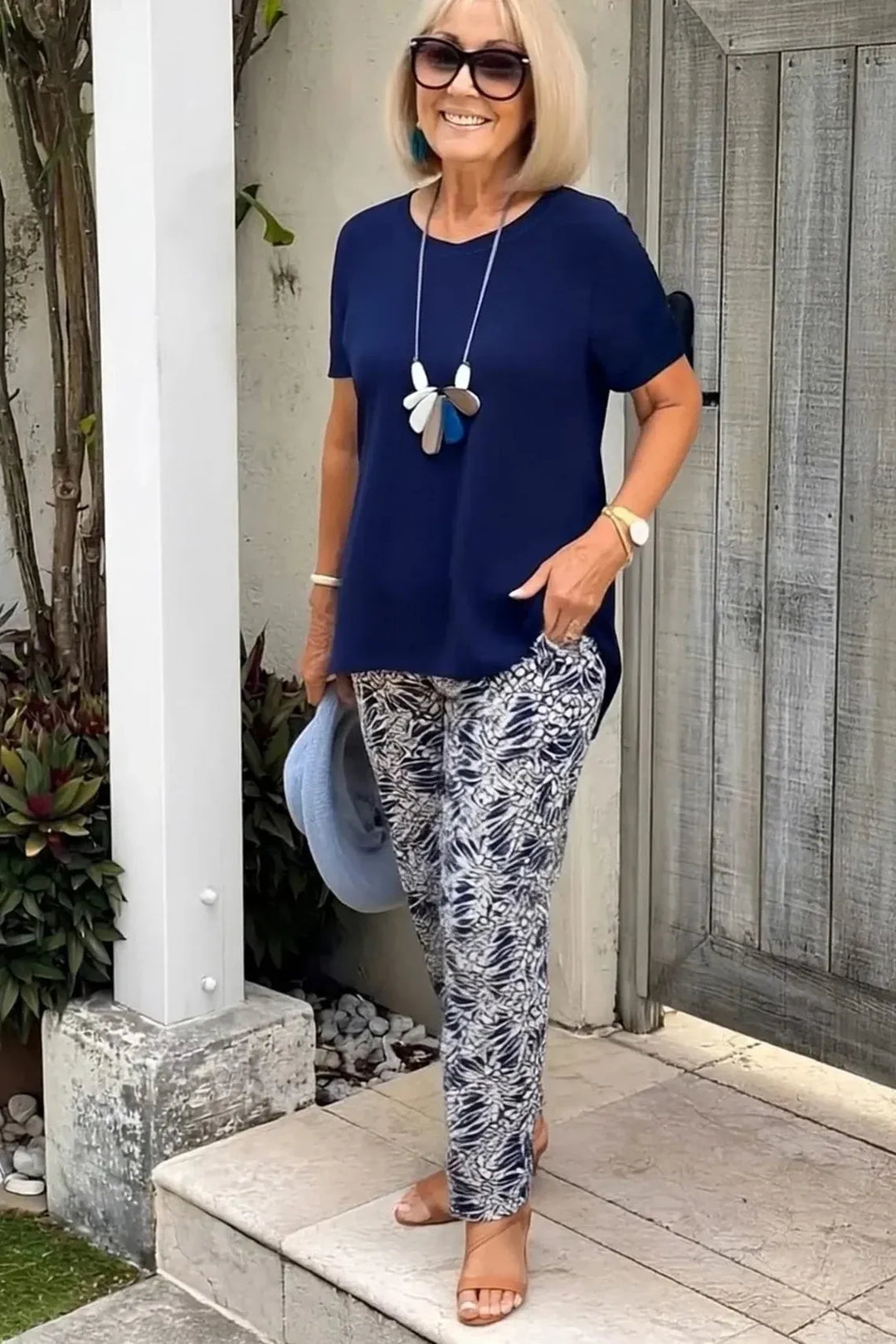 Women's elegant blue patterned blouse with a relaxed fit, perfect for comfortable everyday fashion.