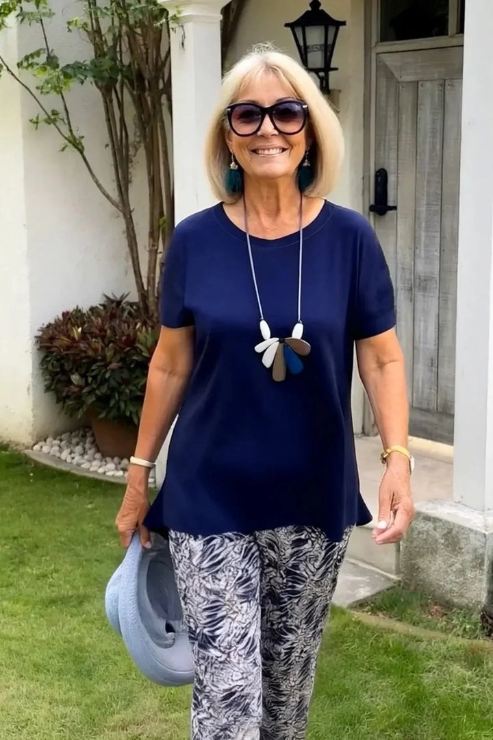 Beautiful blue patterned women's blouse with a relaxed fit for a versatile and elegant look.