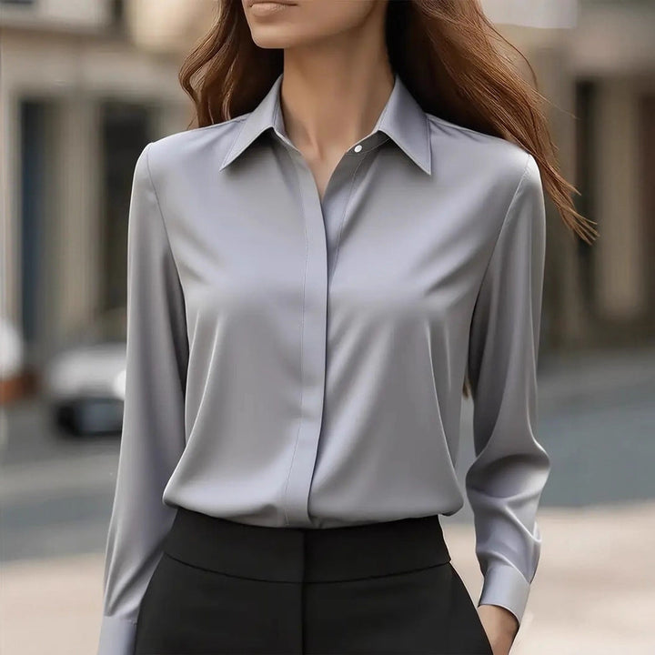 Versatile women's long-sleeve blouse featuring elegant button accents, chic for office or casual.