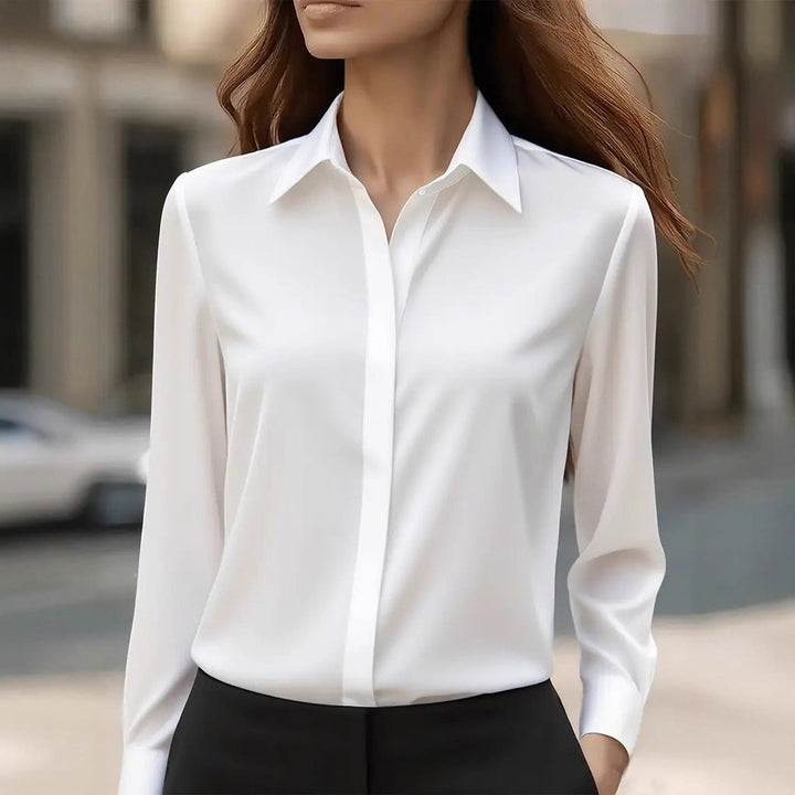 Elegant women's button-front blouse, a sophisticated long-sleeve top for formal & professional style.