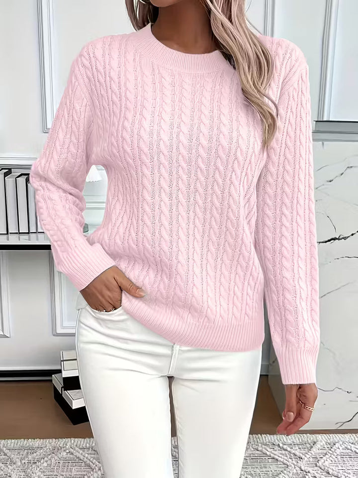 Classic crew neck cable knit women's sweater. A timeless, textured autumn fashion piece.
