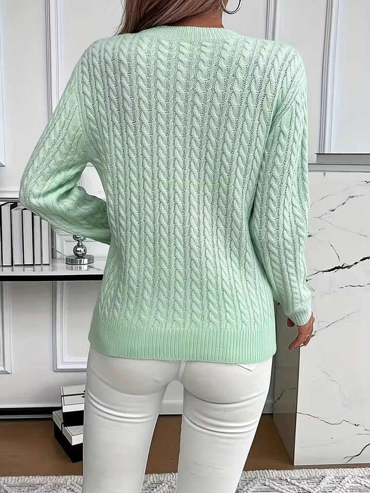 Stylish women's cable knit crew neck sweater. Ideal for chic autumn fashion & cozy casual wear.