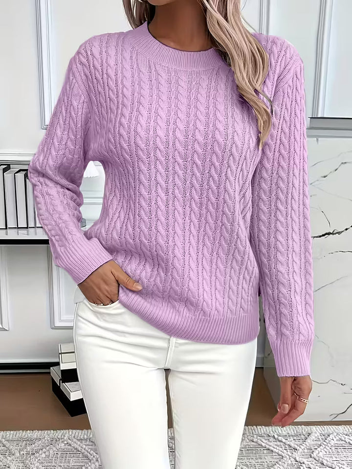 Classic cable knit crew neck women's sweater. An elegant, versatile jumper for autumn fashion.