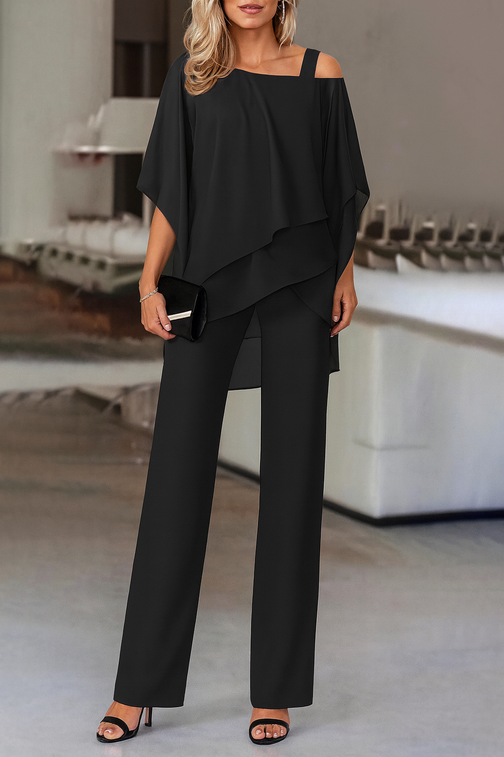 Stylish women's cold-shoulder pants set, a modern two-piece for party wear or elegant vacation outfits.