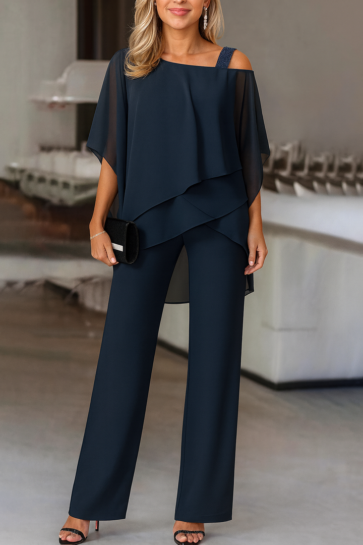 Modern women's elegant cold-shoulder two-piece pants set, a fashionable coordinated look for stylish events.