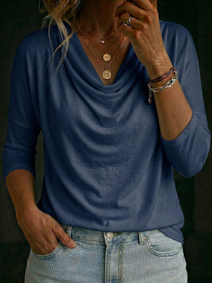 Sophisticated women's relaxed fit top featuring a stylish cowl neck and long sleeves.