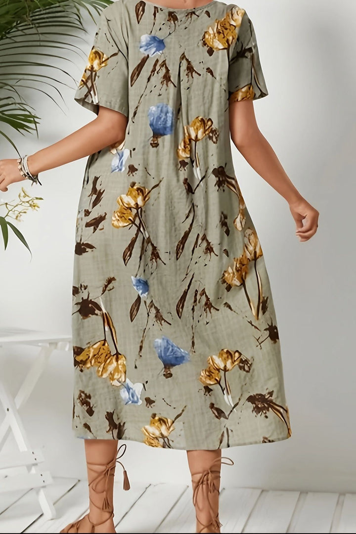 Sophisticated women's floral print midi dress. Perfect elegant casual wear for spring or summer events.