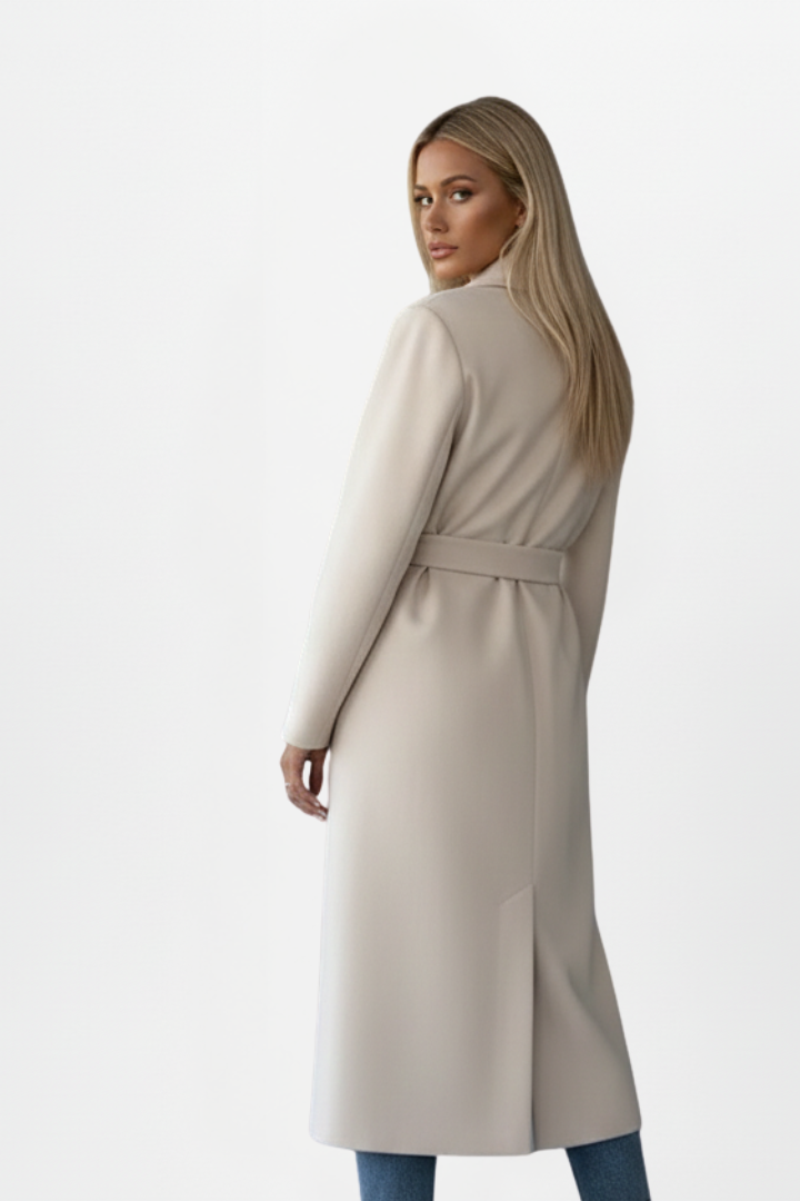 Tailored women's double-breasted long coat with an elegant belted waist and sophisticated notch collar.