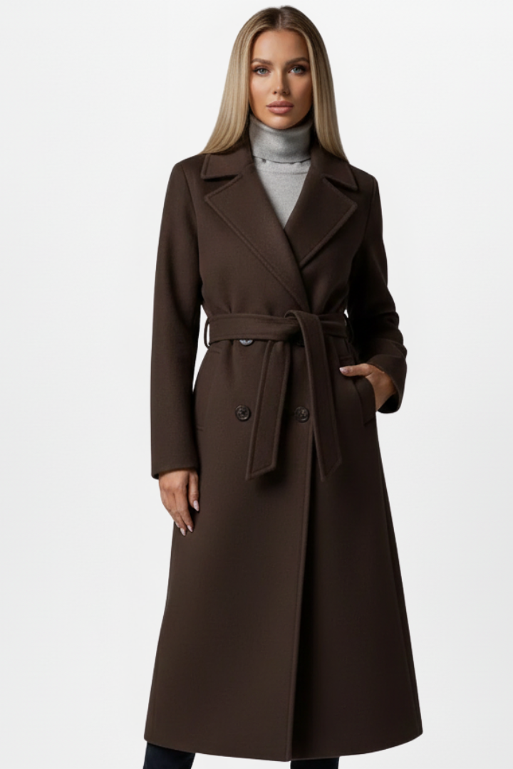 Sophisticated women's fall fashion long coat. Double-breasted, belted, with a sharp notch collar. Workwear.