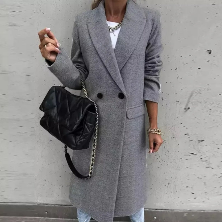 Formal women's winter trench coat, double-breasted design & sophisticated lapel collar for cold weather.