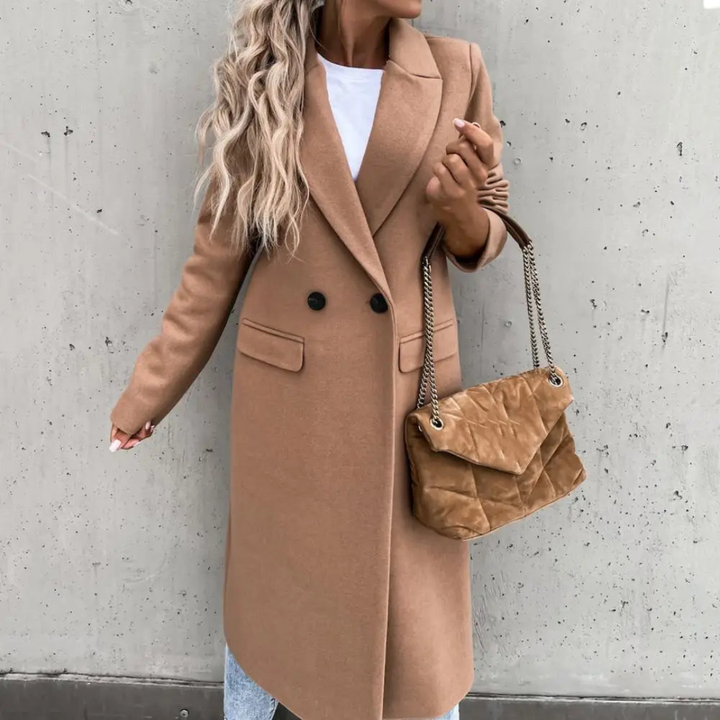 Sophisticated women's trench coat, double-breasted with a smart lapel collar, excellent for formal winter fashion.