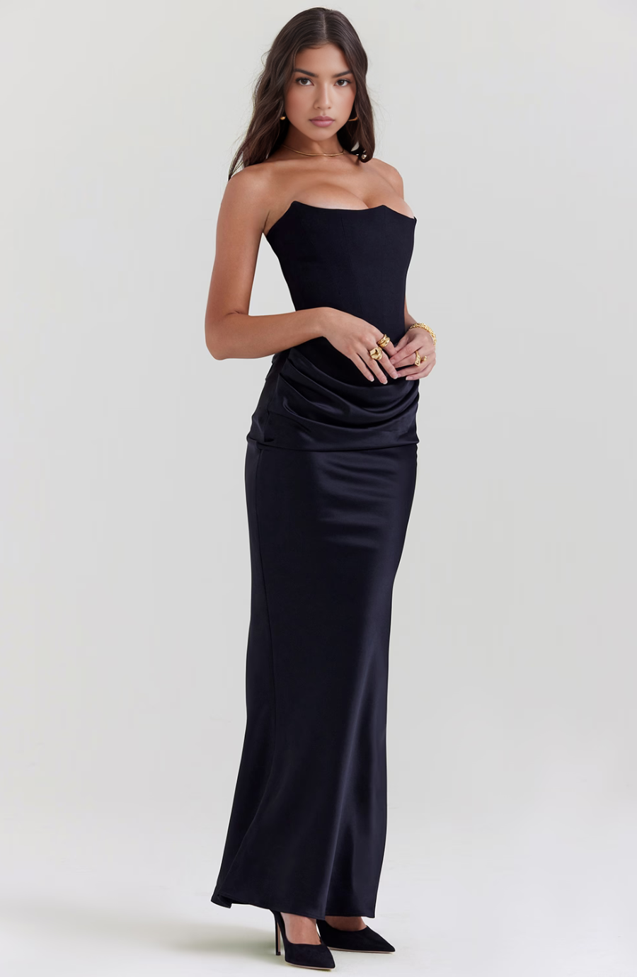 Prom-ready strapless gown with a chic draped column silhouette.