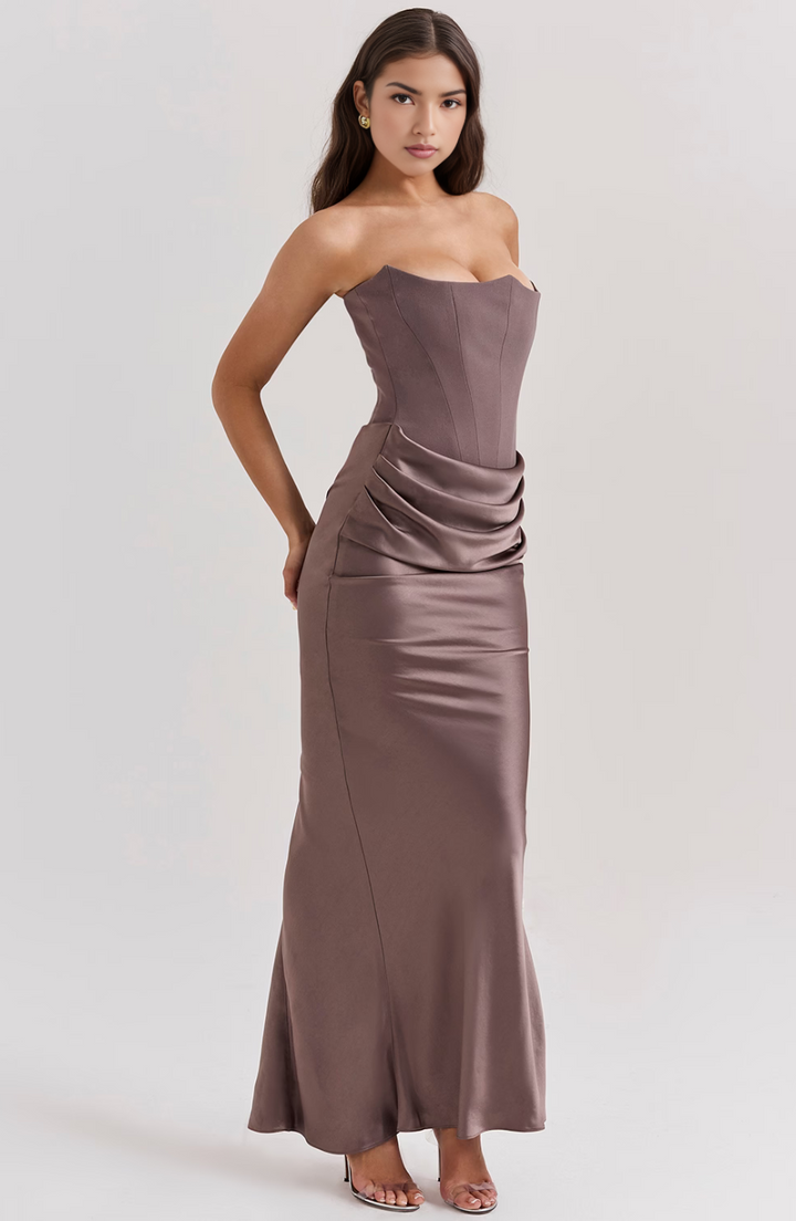 Strapless prom gown, a sophisticated draped design for women.