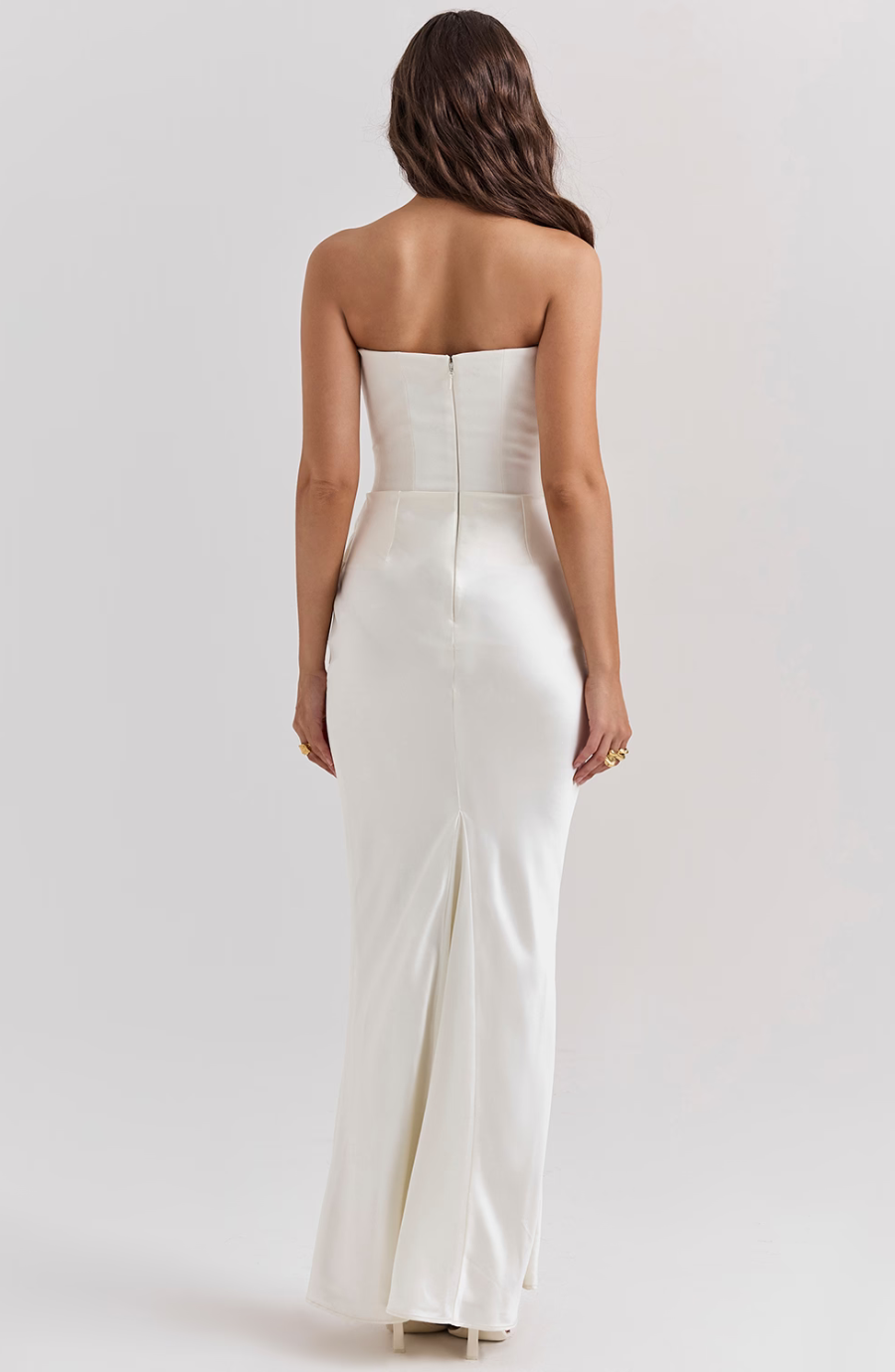 Sophisticated women's strapless homecoming gown, fitted draping.