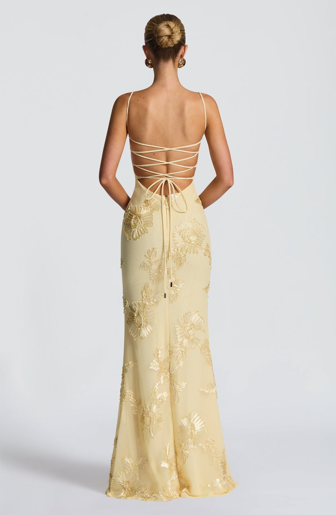 Elegant women's mermaid dress with beautiful floral appliqué, a corset design & long flowing skirt.