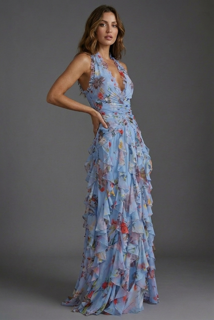 Summer party-ready women's maxi dress with a halterneck, beautiful floral print & flowy ruffle skirt.