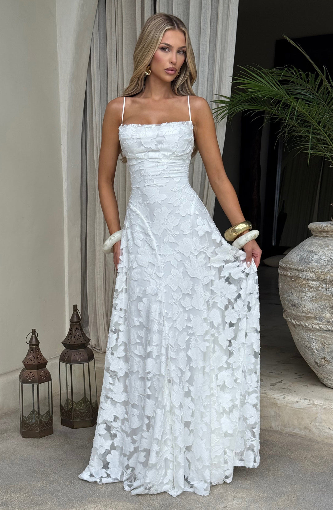 Women's occasion dress: sleeveless floral maxi, A-line silhouette, waterfall neckline, lace-up back.