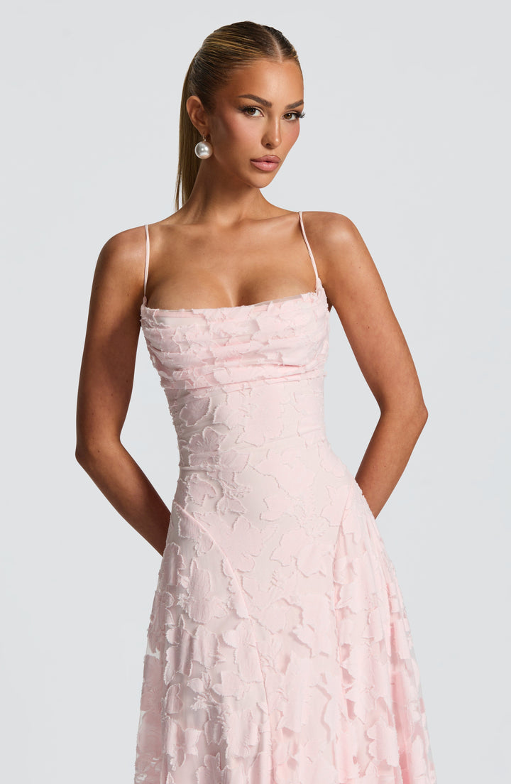 Women's A-line floral maxi dress for spring, featuring a flowing waterfall neckline and adjustable lace-up back.