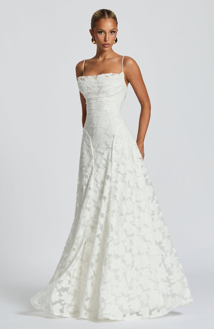 Women's A-line floral maxi dress. Features a graceful waterfall neckline & trendy lace-up back.