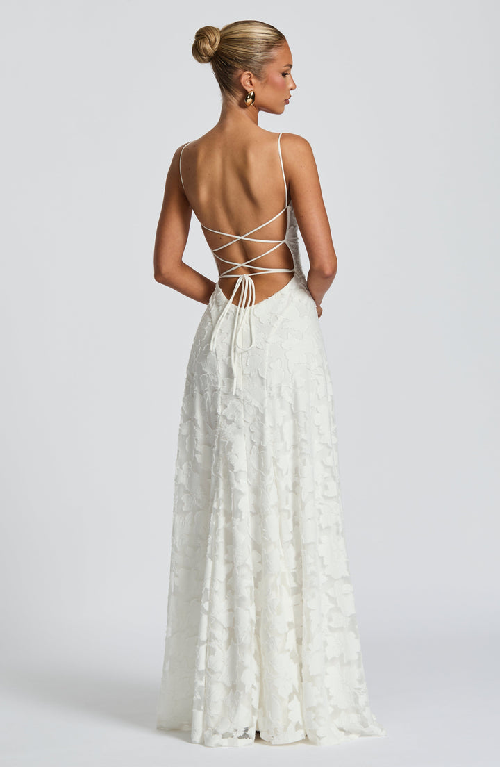 Vacation wear: stunning floral maxi dress with elegant waterfall neckline and adjustable lace-up back.