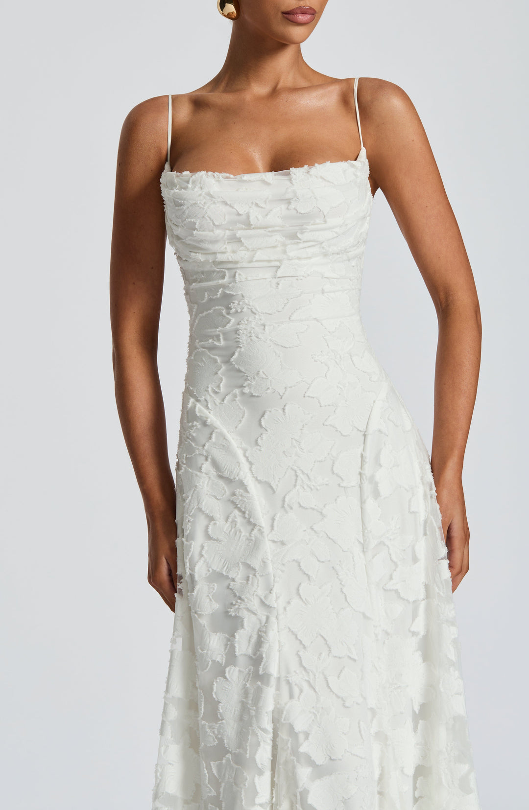 Party-ready floral maxi dress for women, with a flattering waterfall neckline and intricate lace-up back.