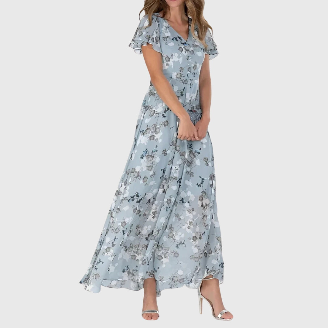 Flowy boho floral maxi dress for women, featuring a V-neck & flutter sleeves, ideal for vacations or casual wear.