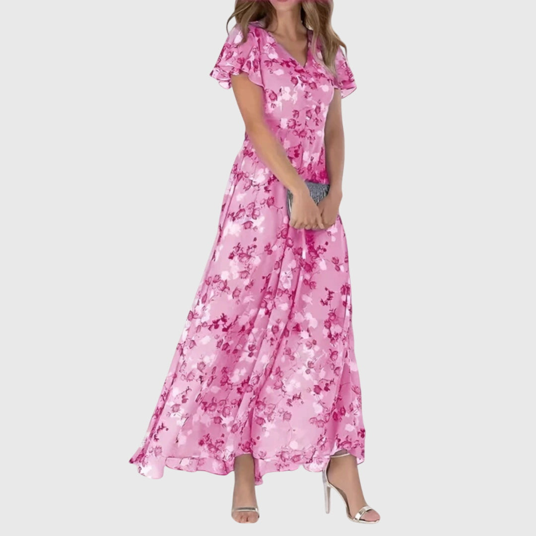 Vibrant spring/summer floral maxi dress with elegant V-neck & flutter sleeves, a beautiful flowy women's long dress.