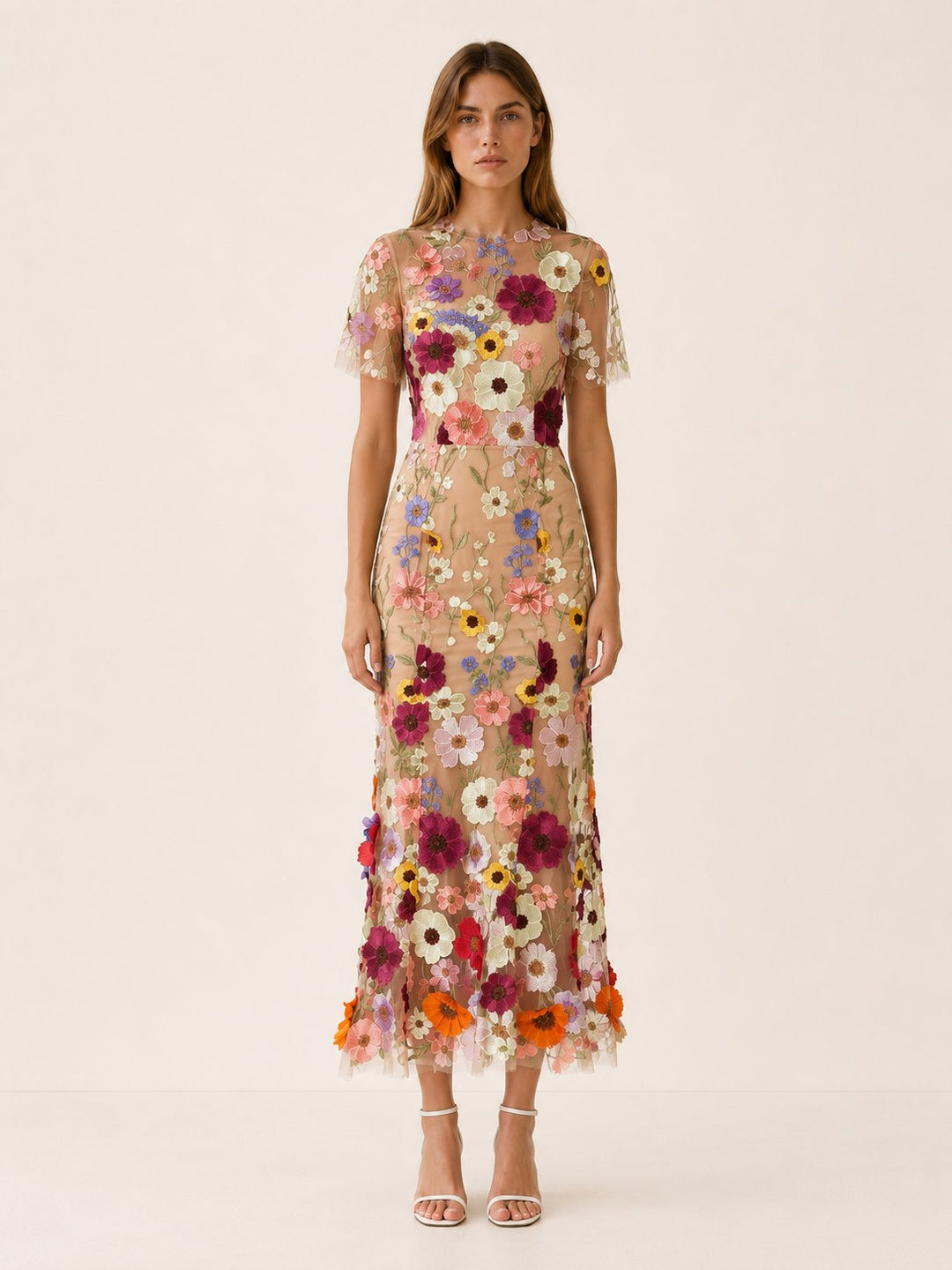 Sophisticated women's floral midi dress with a round neck and short sleeves, an elegant choice for any occasion.
