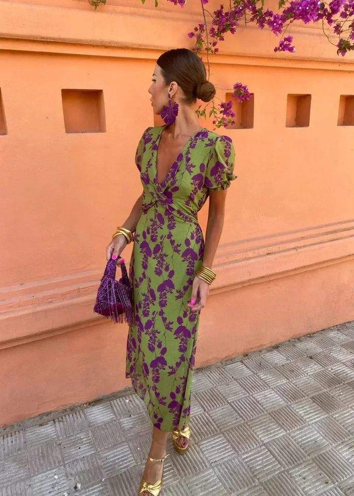 Sophisticated women's floral midi dress, a flattering wrap V-neck style with chic puff sleeves for vacation.