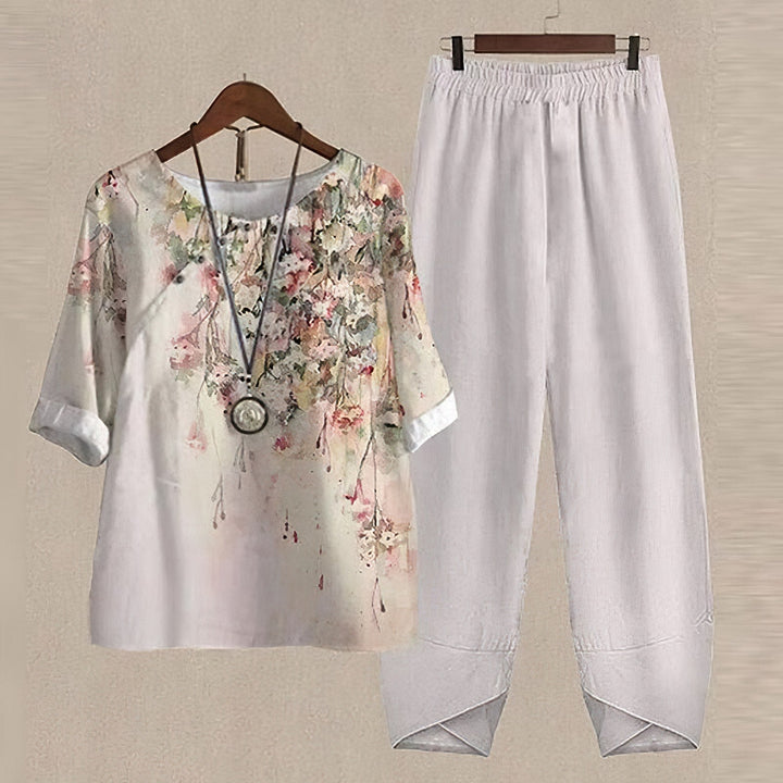 Elegant women's floral print long-sleeve blouse, part of a breathable two-piece set, suitable for summer.
