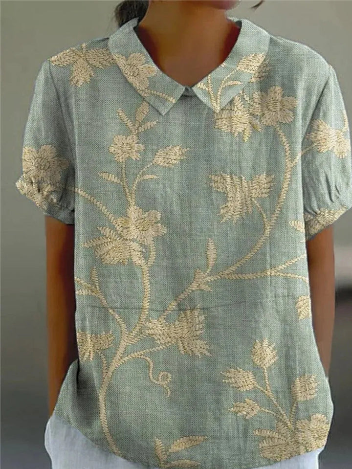 Women's elegant floral print blouse with a relaxed fit, perfect for summer and spring fashion.
