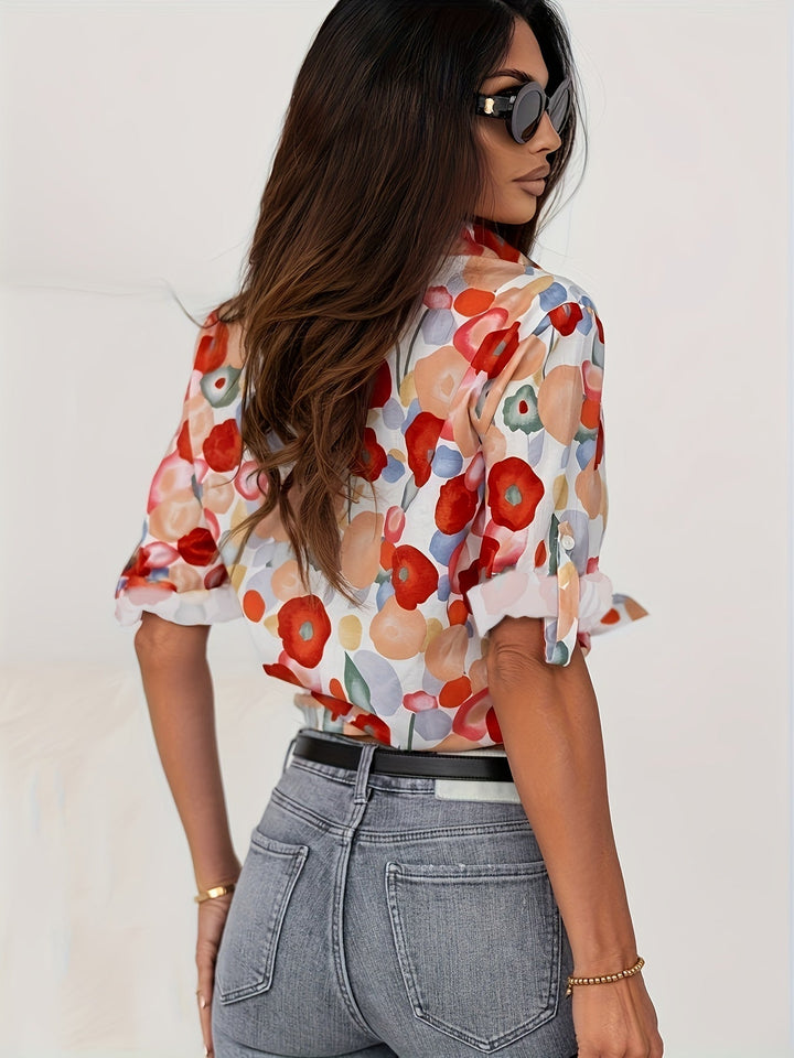 Artistic floral print long sleeve blouse for women. Features a classic button-down design, ideal for an elegant look.