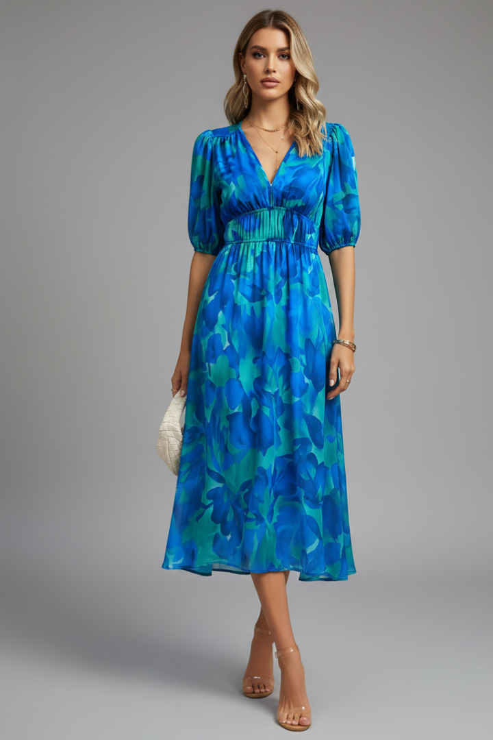 Chic women's midi dress featuring elegant puff sleeves, a vibrant floral print, and flattering V-neckline for spring.