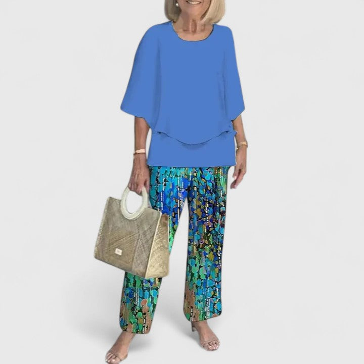Women's elegant floral print matching set, featuring wide leg trousers and top.