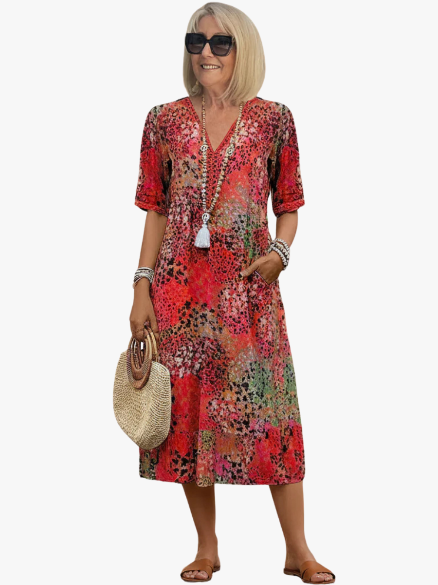 Women's elegant floral printed V-neck midi dress. Perfect versatile A-line summer dress for casual or dressed-up looks.