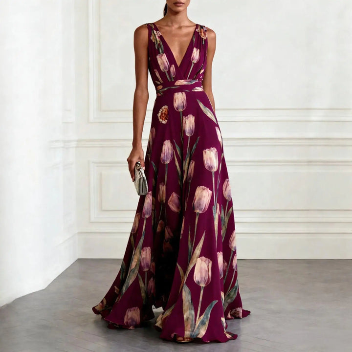 Close-up of vibrant floral tulip print and deep V-neck on a women's elegant maxi dress for parties.