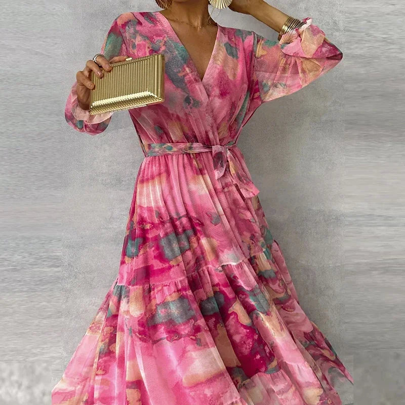 Beautiful women's floral wrap maxi dress. Elegant V-neck, long sleeves, and a stylish tiered skirt for events.