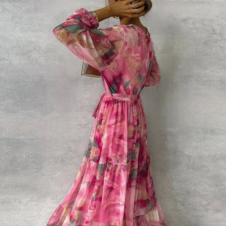 Elegant women's floral V-neck wrap maxi dress, featuring long sleeves & a tiered skirt. Perfect for formal events.