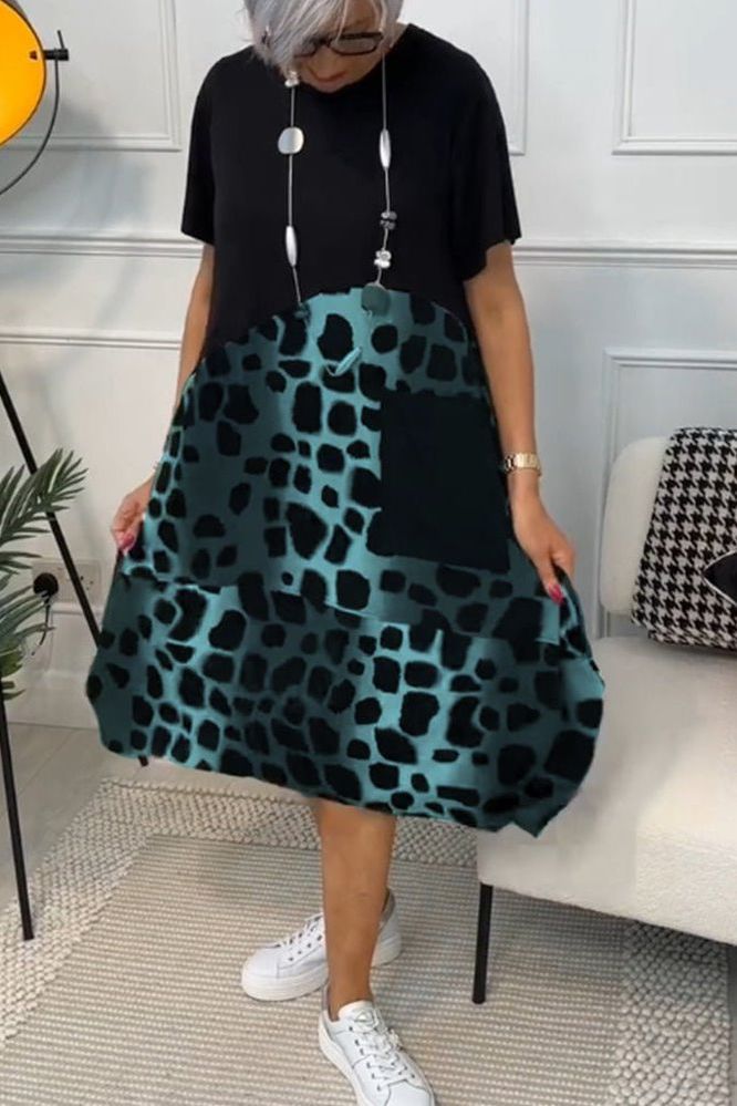 Sophisticated floral midi dress for women, defined waist, ideal for summer events.
