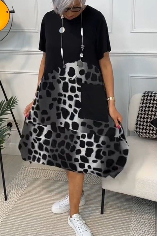 Casual women's floral midi dress with an elegant waist definition. Ideal for summer.