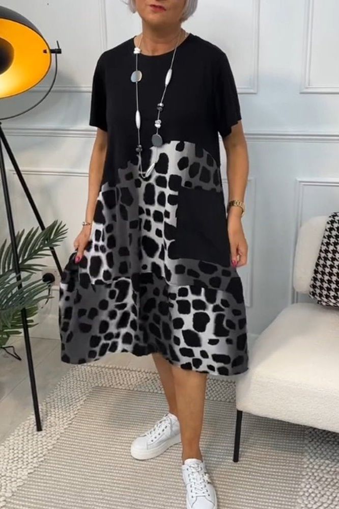 Feminine waist-defined floral midi dress for women. A chic and flowy spring essential.