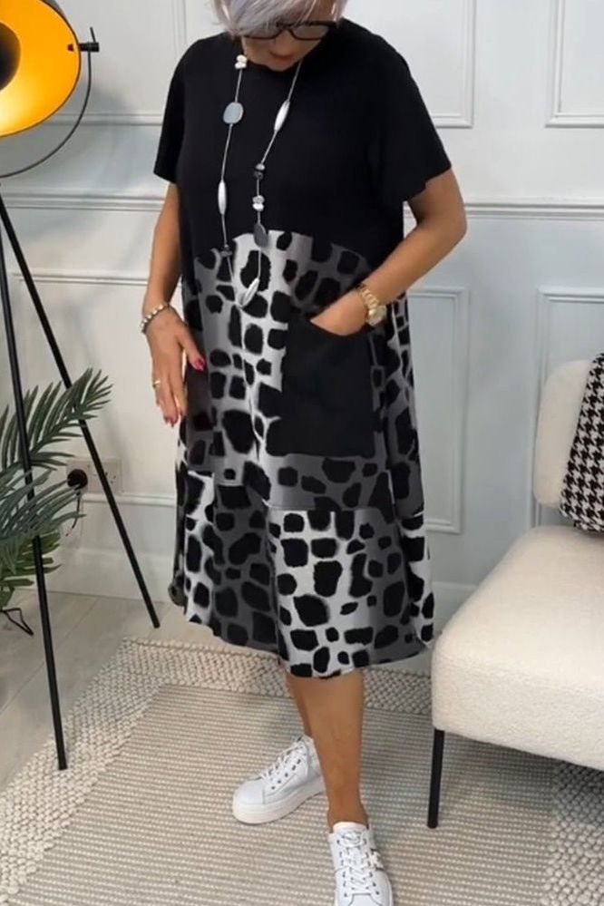 Women's versatile floral midi dress, elegant waist-defined style. Perfect for day or evening.