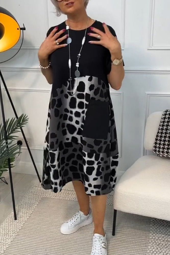 Stylish women's floral summer dress, waist-defined and flowy. Sophisticated casual wear.