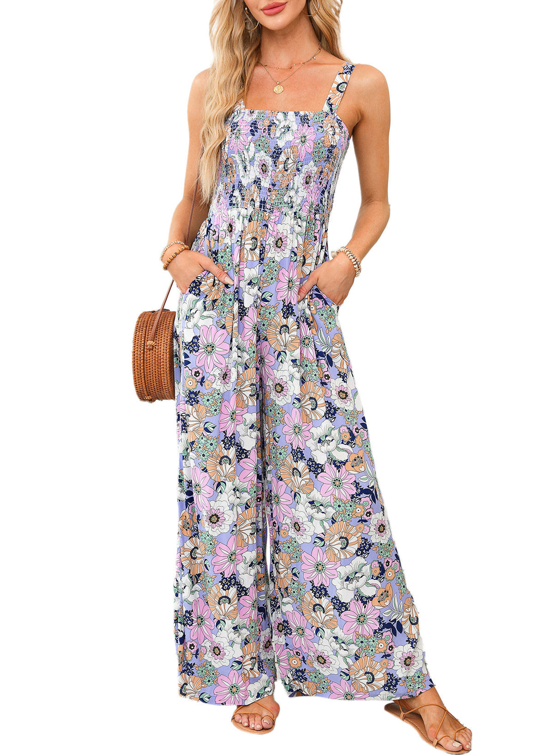 Closeup of the vibrant floral print on an elegant women's wide-leg spring jumpsuit.