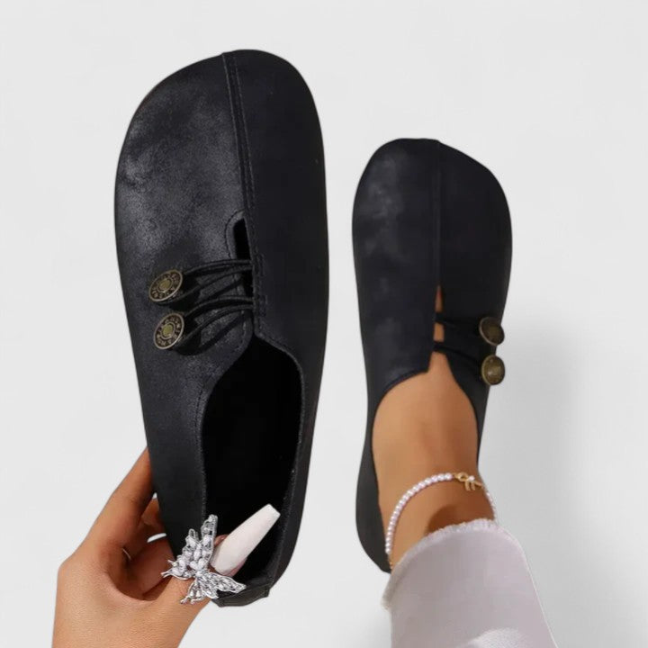 Elegant women's loafers with elastic button closure. Comfortable slip-on footwear, padded insole for daily wear.
