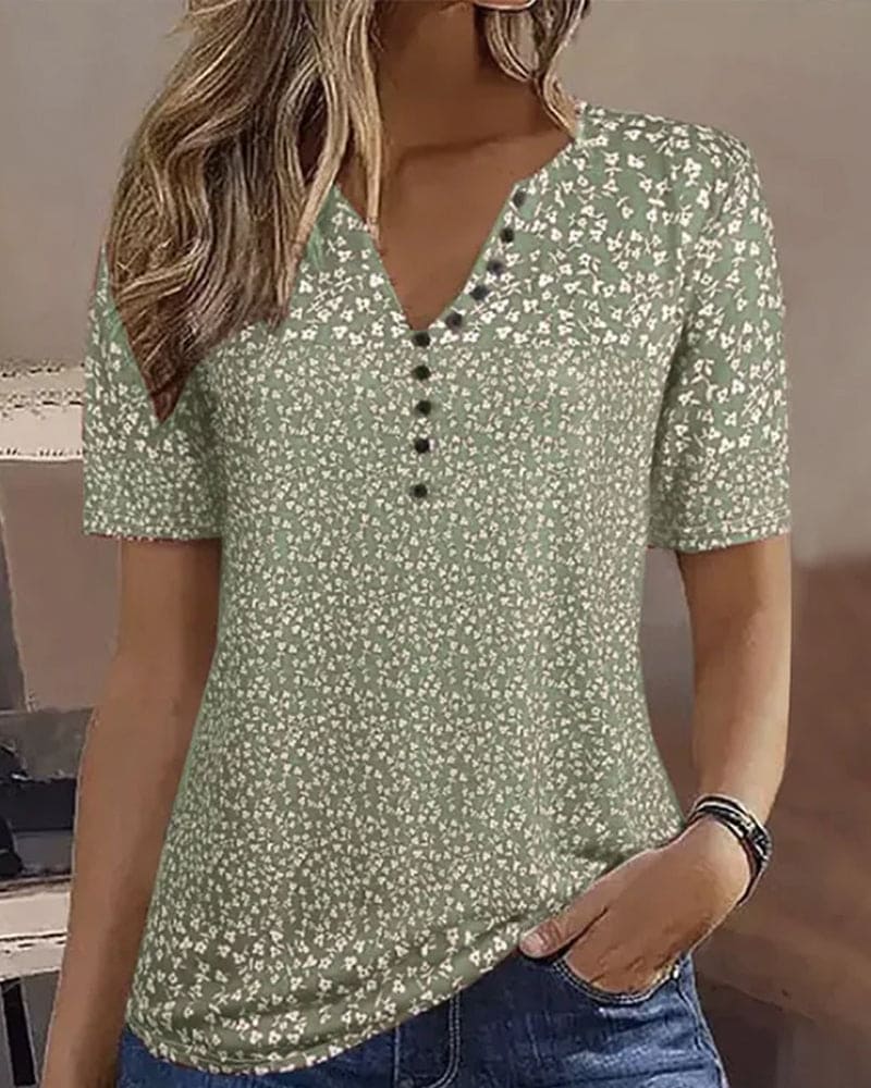 Stylish women's relaxed fit floral summer top. Green elegant short sleeve blouse, perfect for spring casual wear.