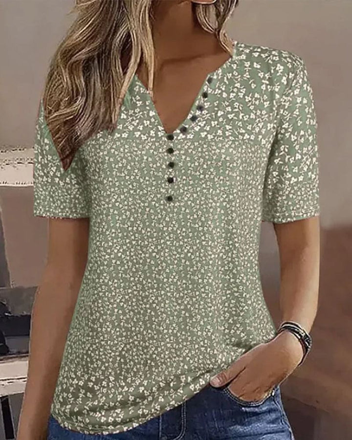 Stylish women's relaxed fit floral summer top. Green elegant short sleeve blouse, perfect for spring casual wear.